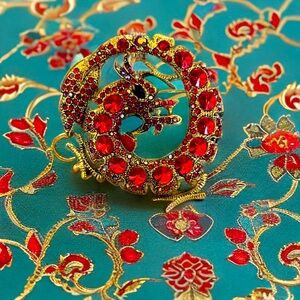 Red dragon, brooch, and pendant